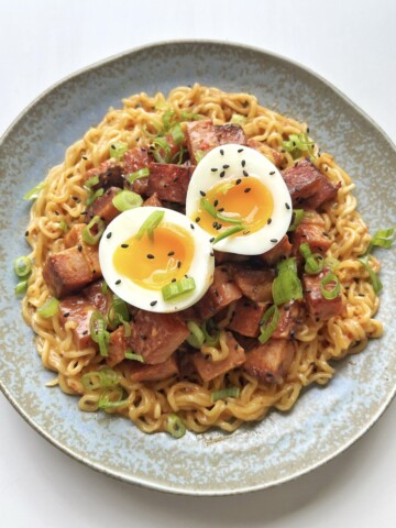Spam Ramen with Egg on top of blue plate