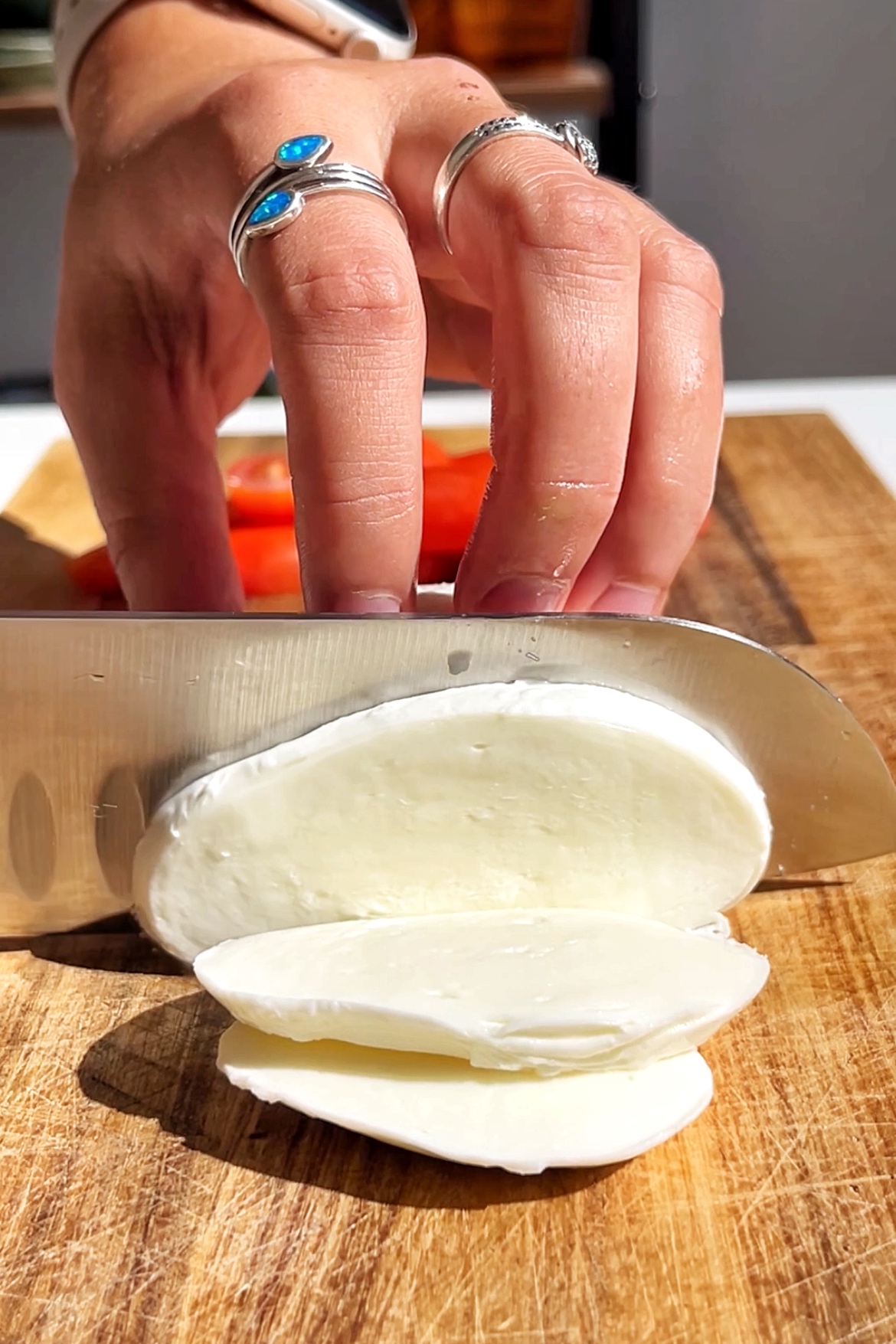 Slicing mozzarella.