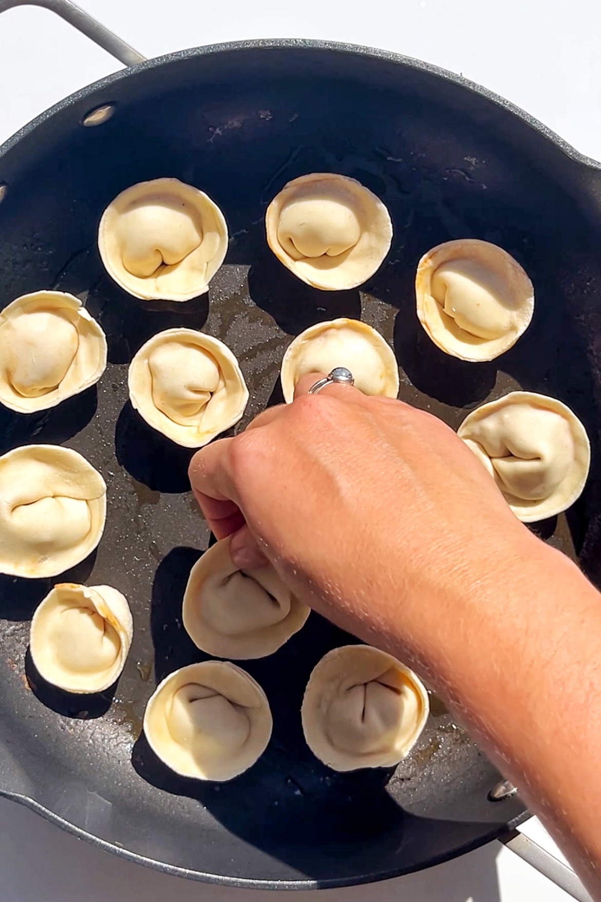 Pan-steaming dumplings.