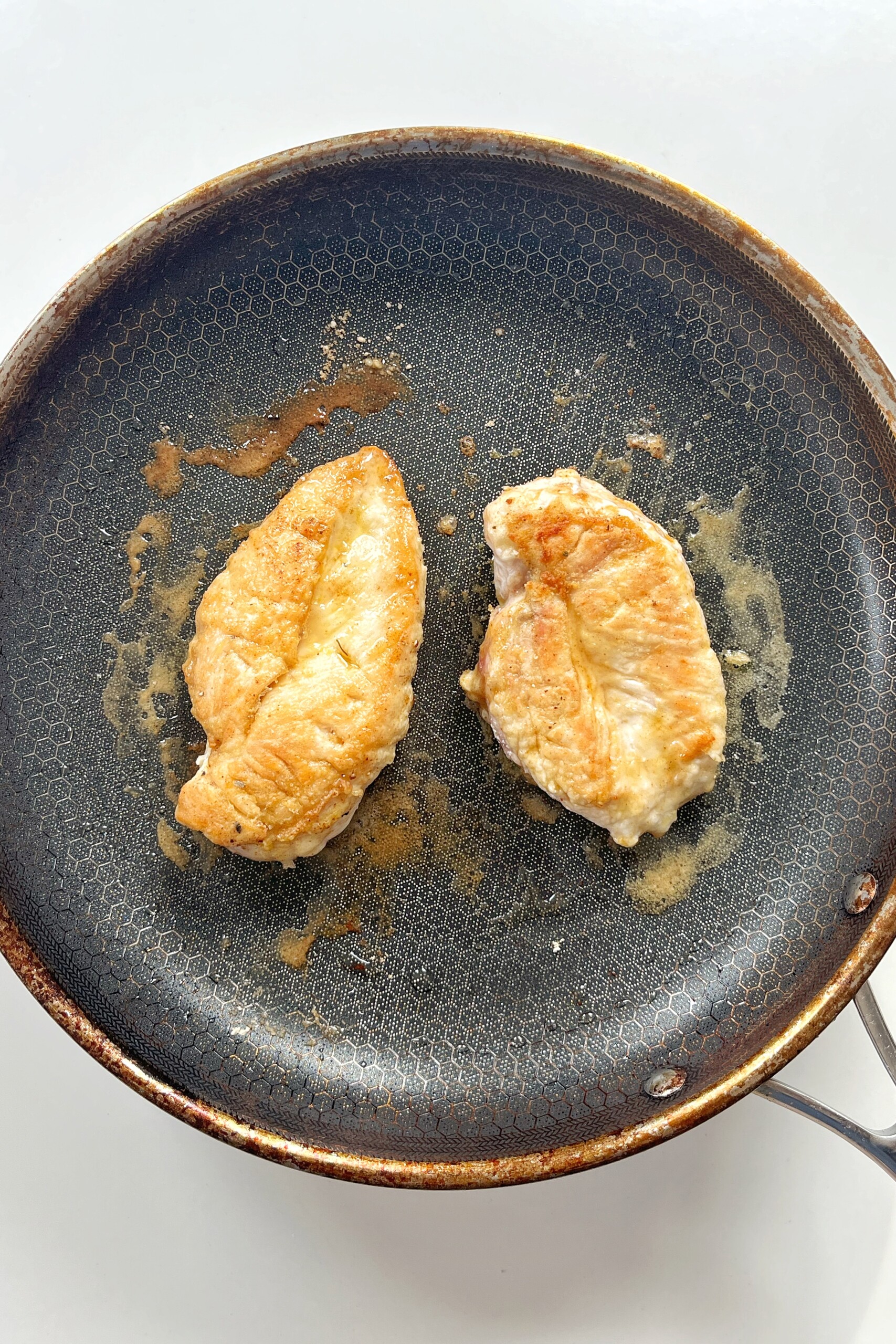 Fry chicken breast in non-stick pan. 