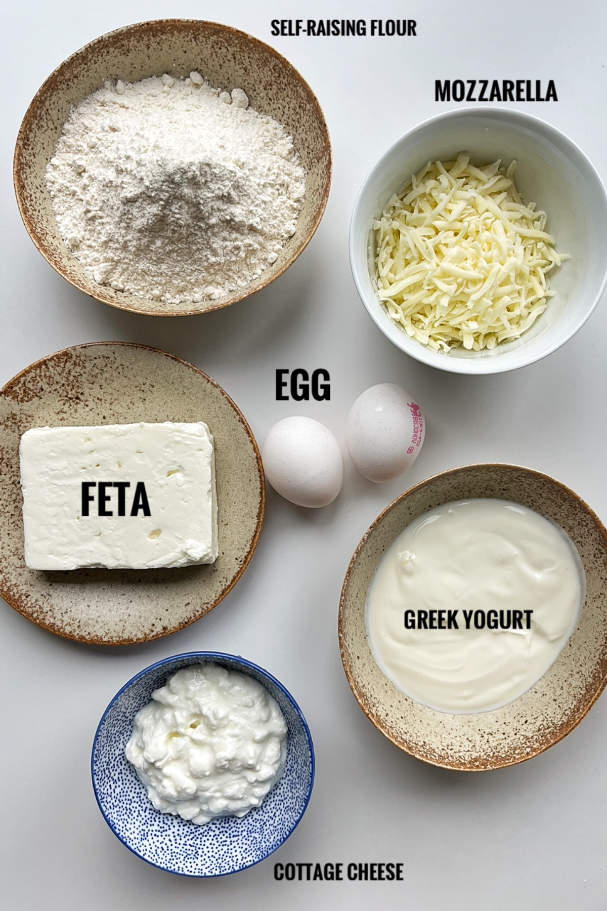 List of ingredients for cheese boat pies include self raising flour, mozzarella, feta, eggs, cottage cheese, and greek yoghurt. 