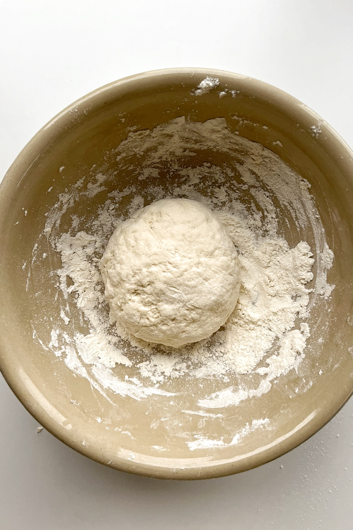 A ball of dough in a large bowl. 