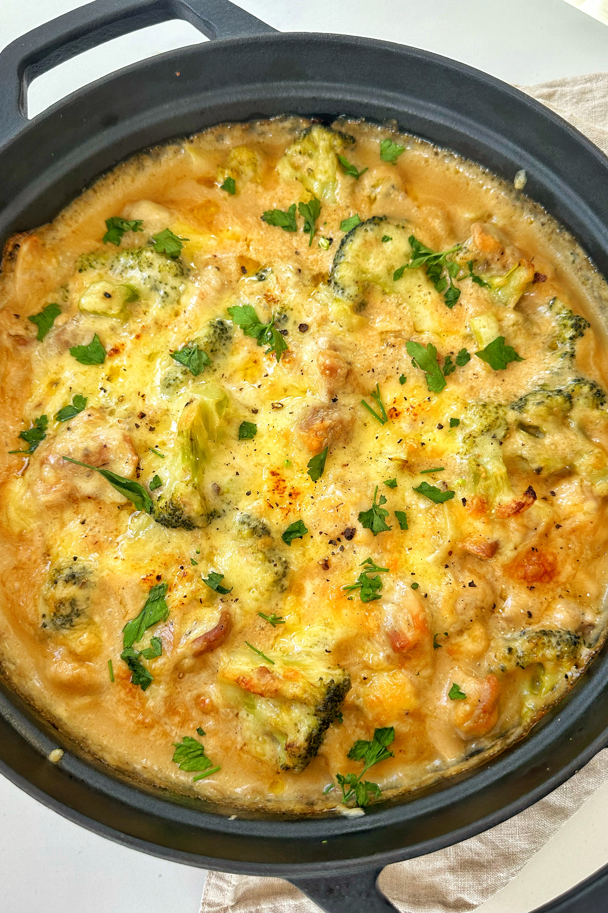 Chicken casserole in a black dish.