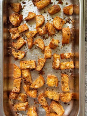 Crunchy ciabatta croutons in a baking tin.