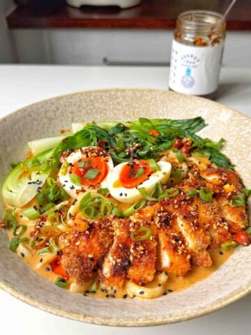 Chicken katsu ramen in a white bowl.