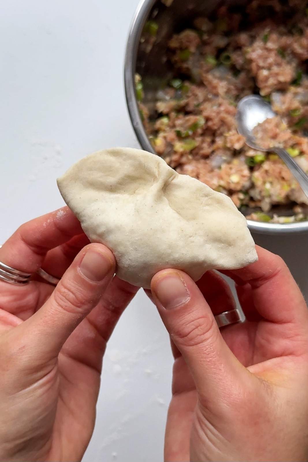 Folding pork and shrimp dumplings.