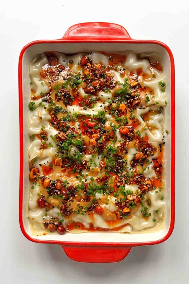 A beautifully plated serving of dumpling lasagna with garnish