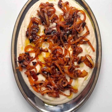 white bean dip on metal tray.