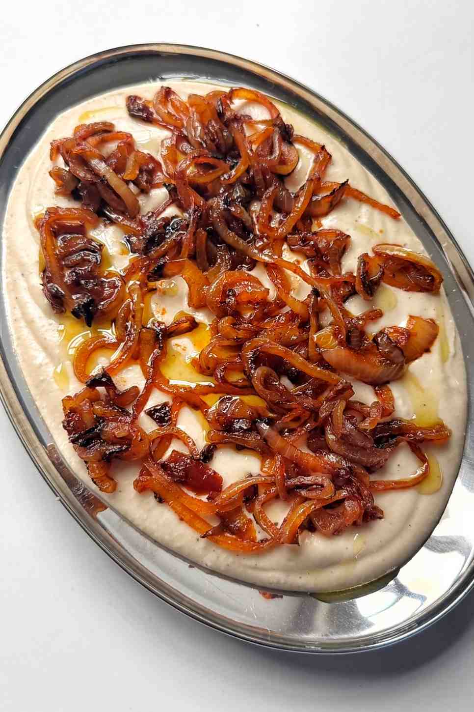 white bean dip topped with caramelised onions.
