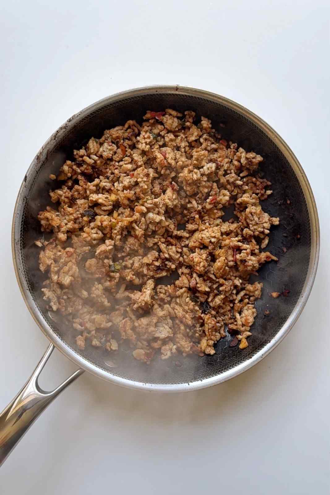 Spiced ground meat cooked in a pan with chilli bean sauce and Sichuan peppercorns for viral creamy mapo udon