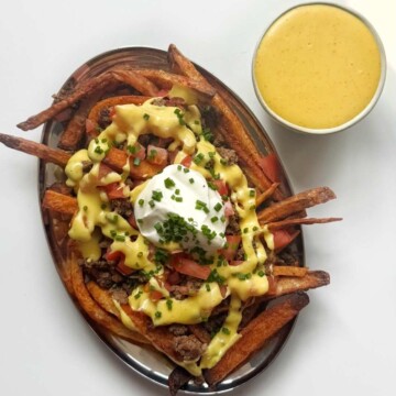 Copycat Taco Bell loaded nacho fries with cheese sauce.