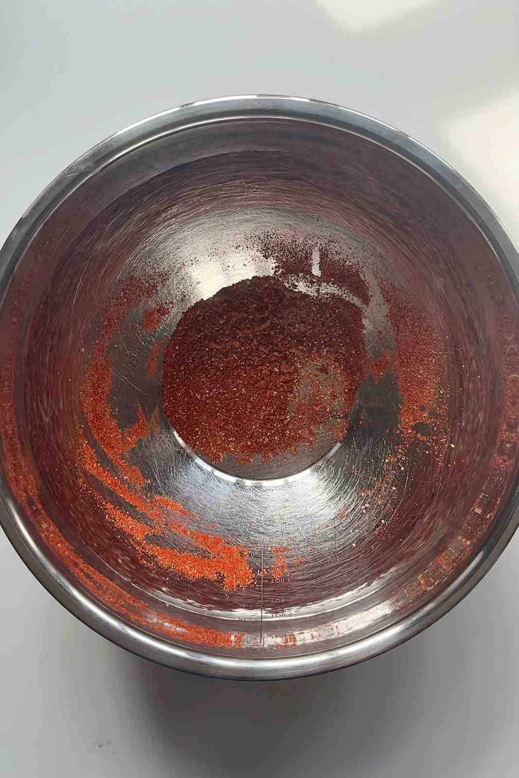 Nacho fries seasoning blend of paprika, chili powder, cumin and garlic powder in a metal bowl