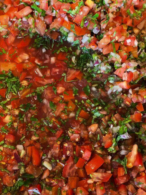 Close-up of fresh homemade pico de gallo with diced tomatoes, red onion, cilantro and jalapeño
