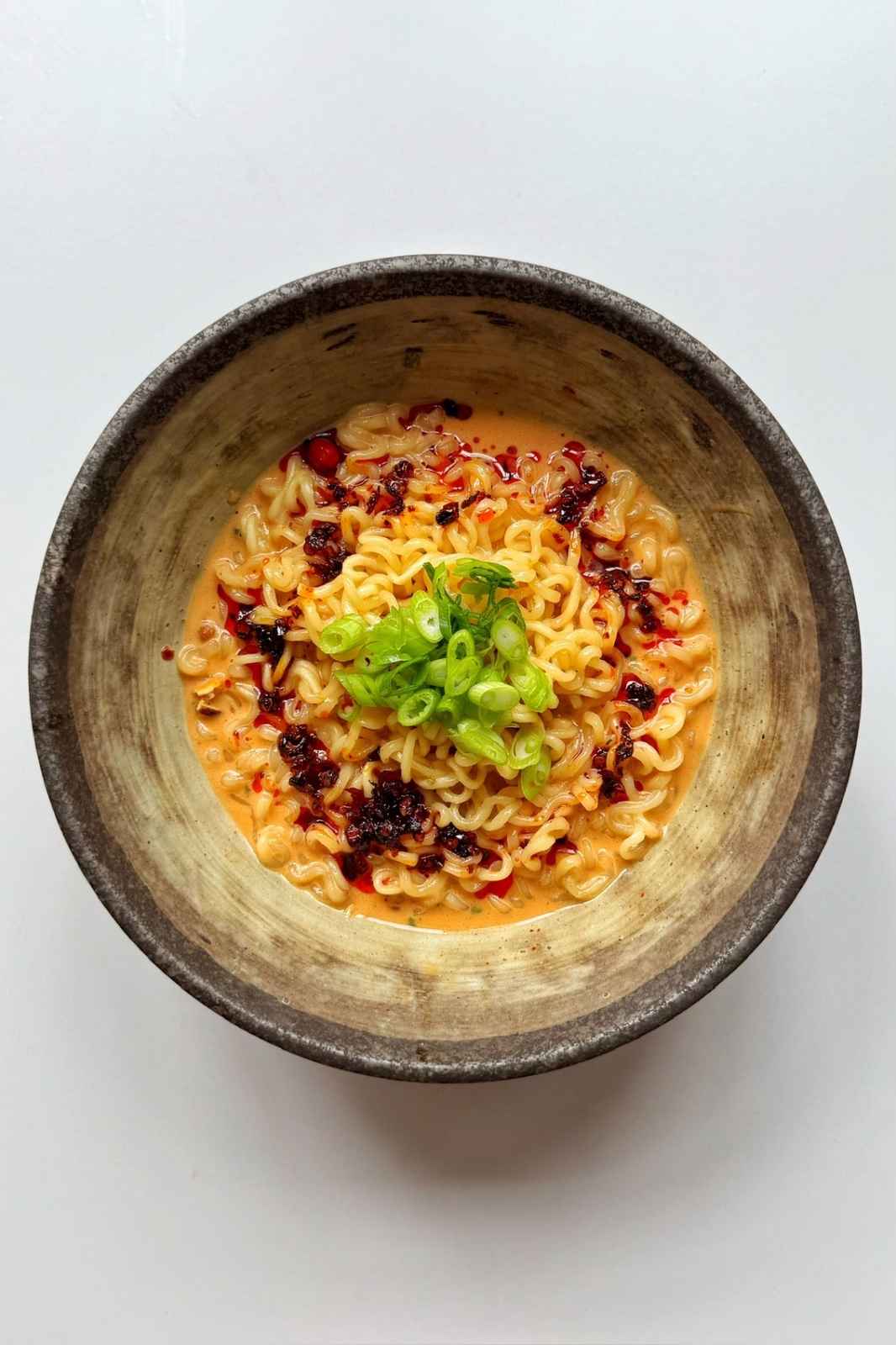 kewpie creamy ramen hack in brown bowl.