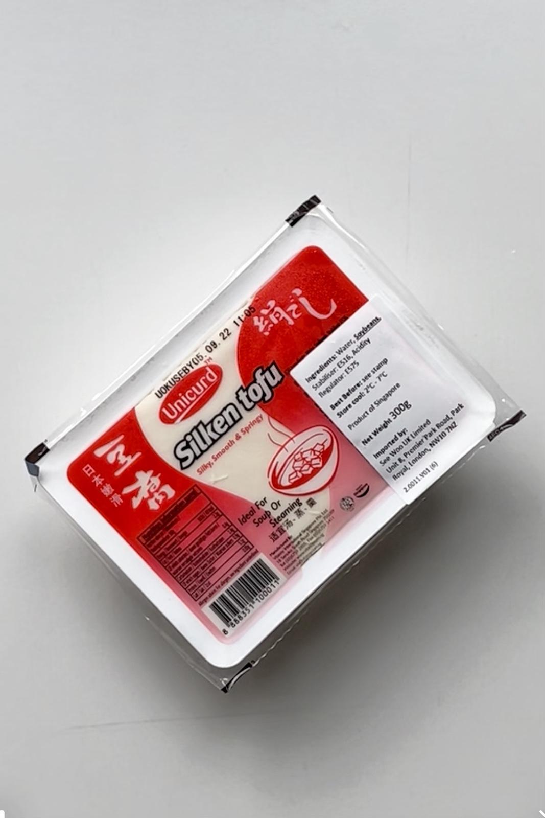 a packet of silken tofu on white background.
