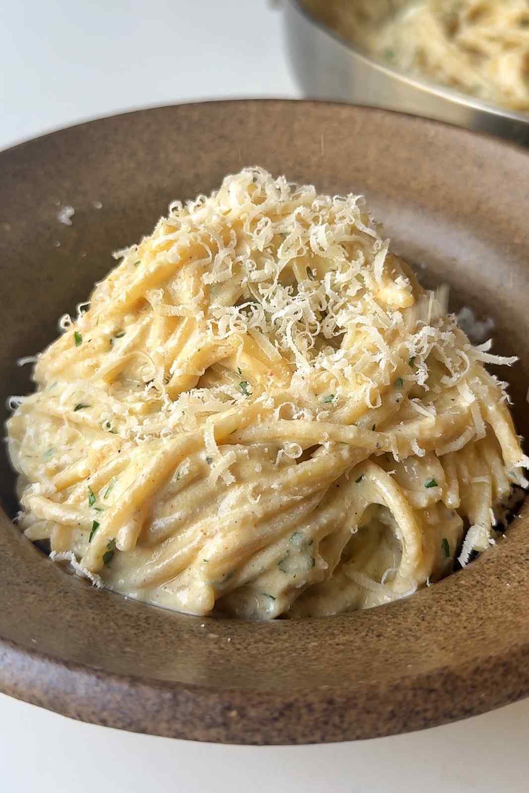 Silken tofu pasta sauce in a brown bowl.