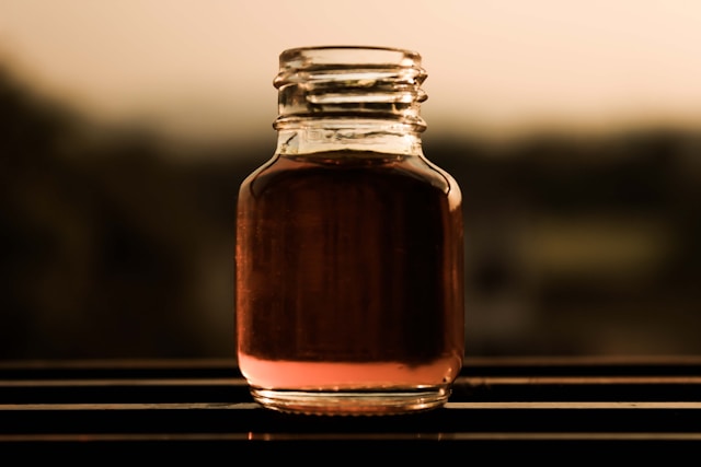 Bottle of maple extract, used with other sweeteners as a maple syrup substitute.