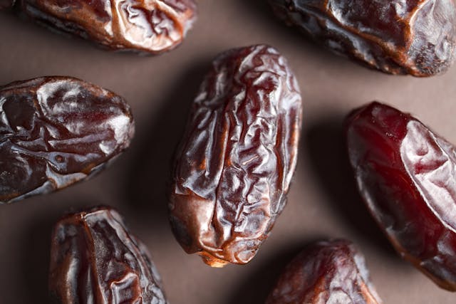 Close-up of Medjool dates, the fruit used to make date syrup.