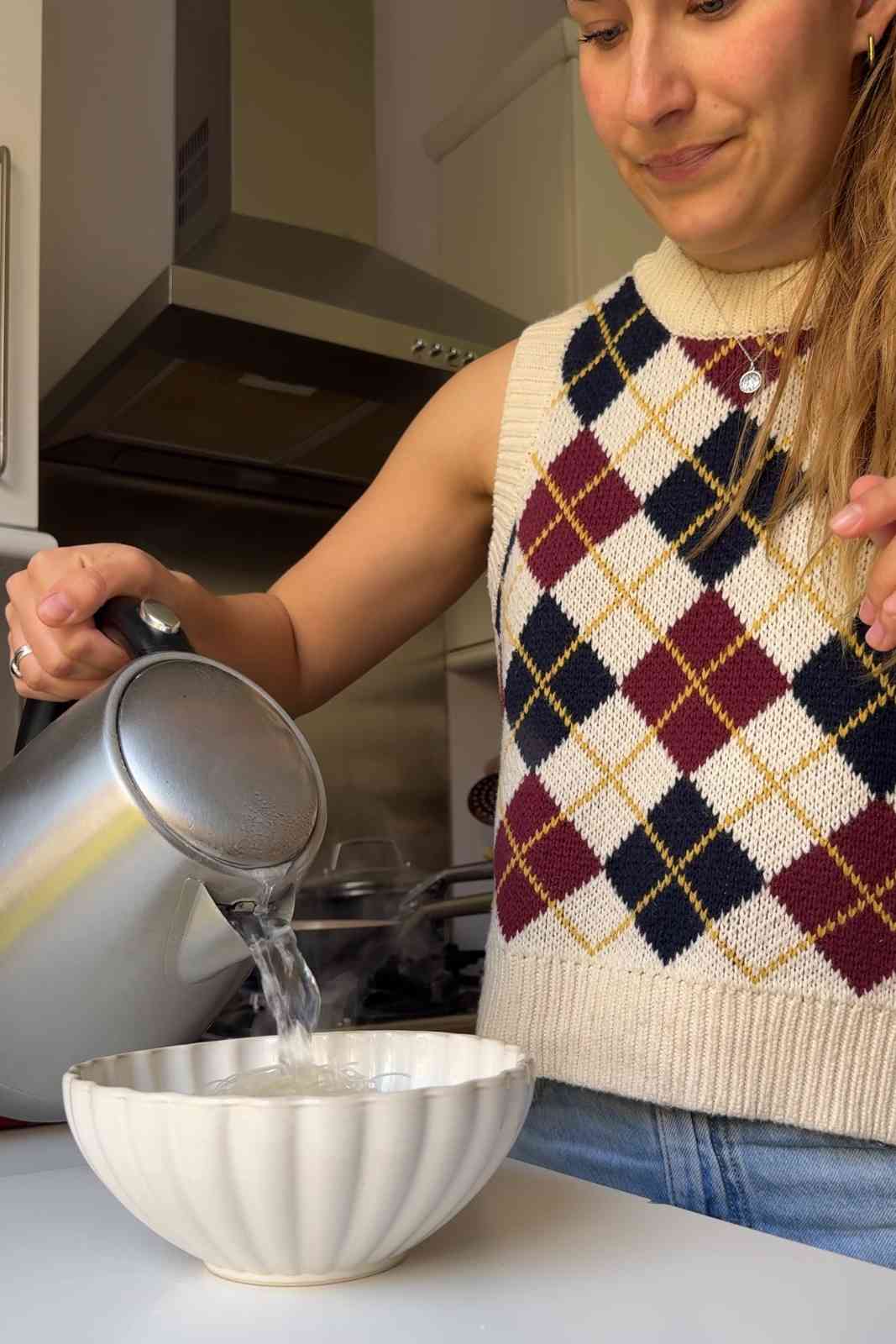 Pouring boiling water over vermicelli noodles.