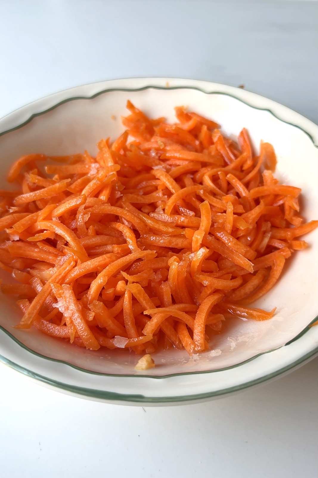 A bowl of grated carrots.