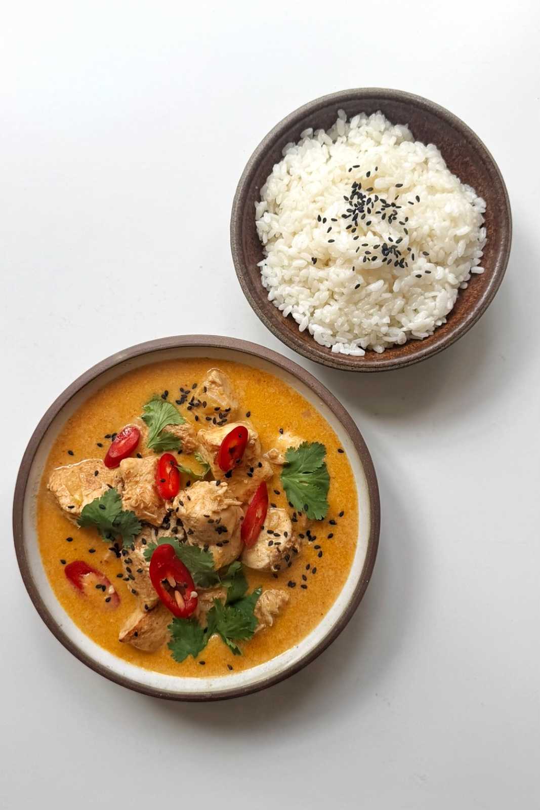 Serving up thai peanut chicken curry with rice.