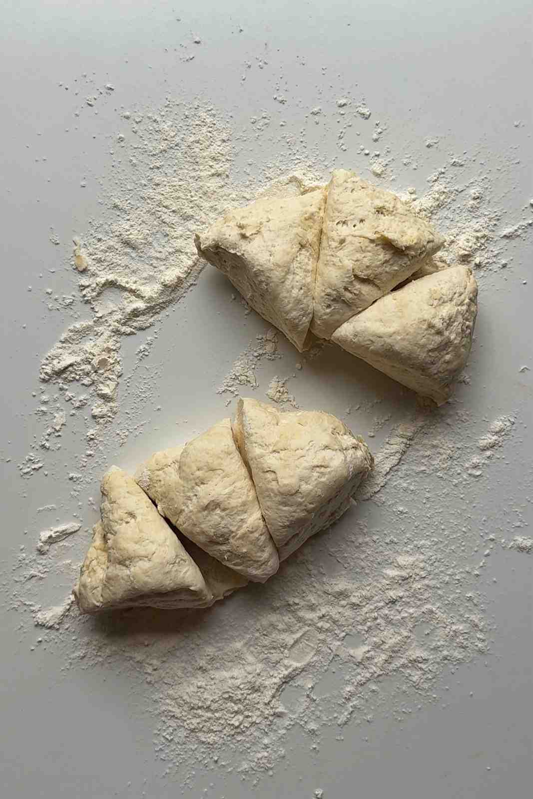 Slicing the dough into six pieces.