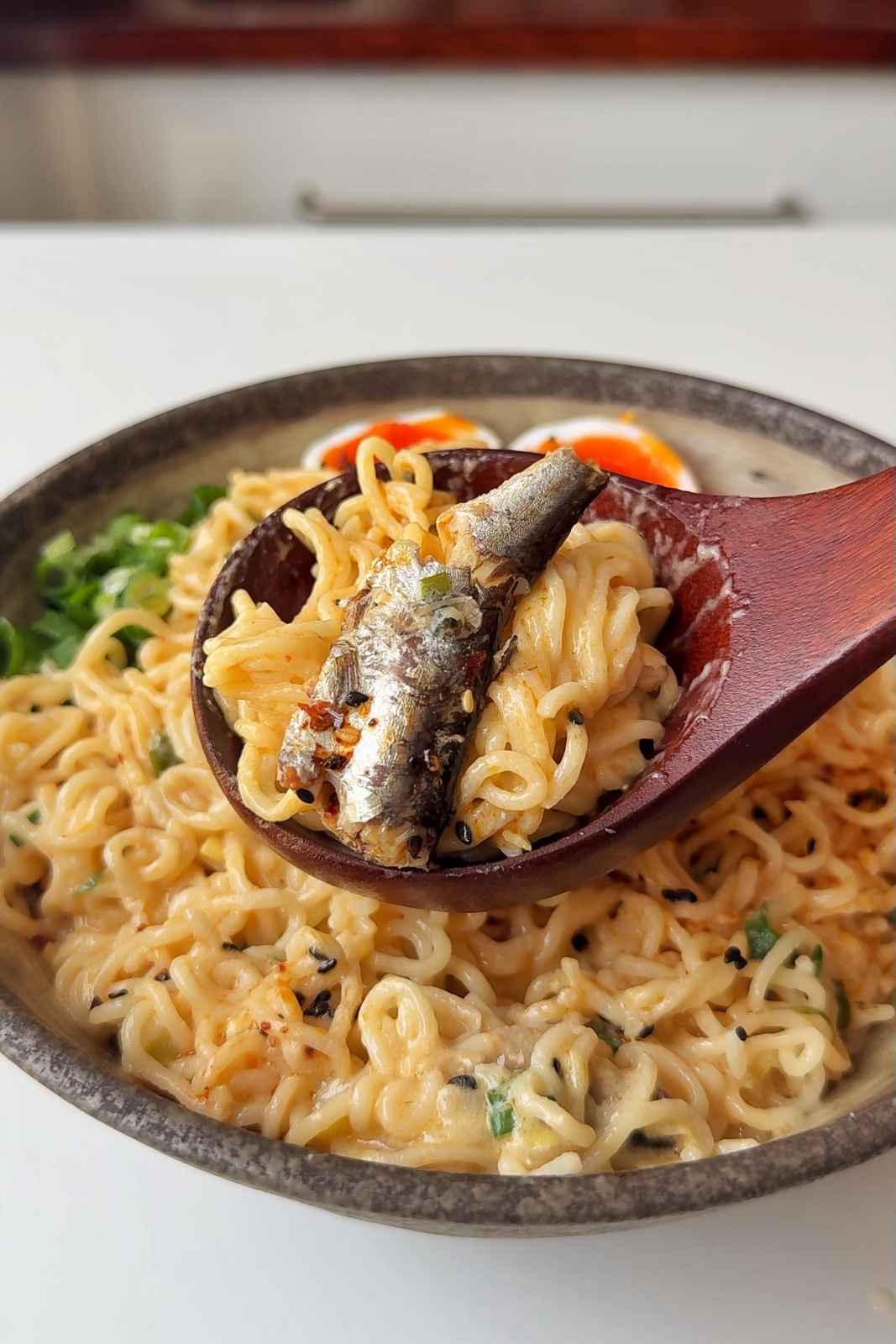 Spoonful of sardine ramen.