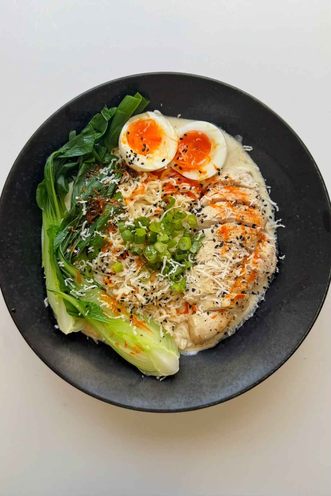 Chicken caesar ramen in a bowl.