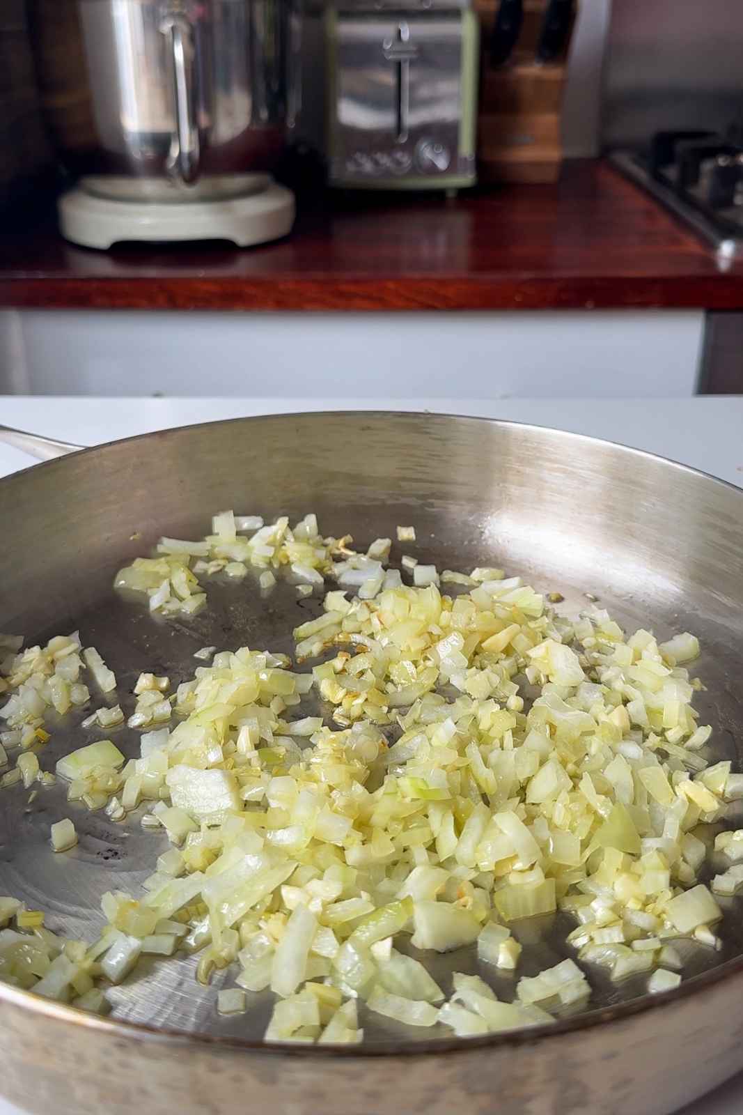 Frying garlic and onion in a pan.
