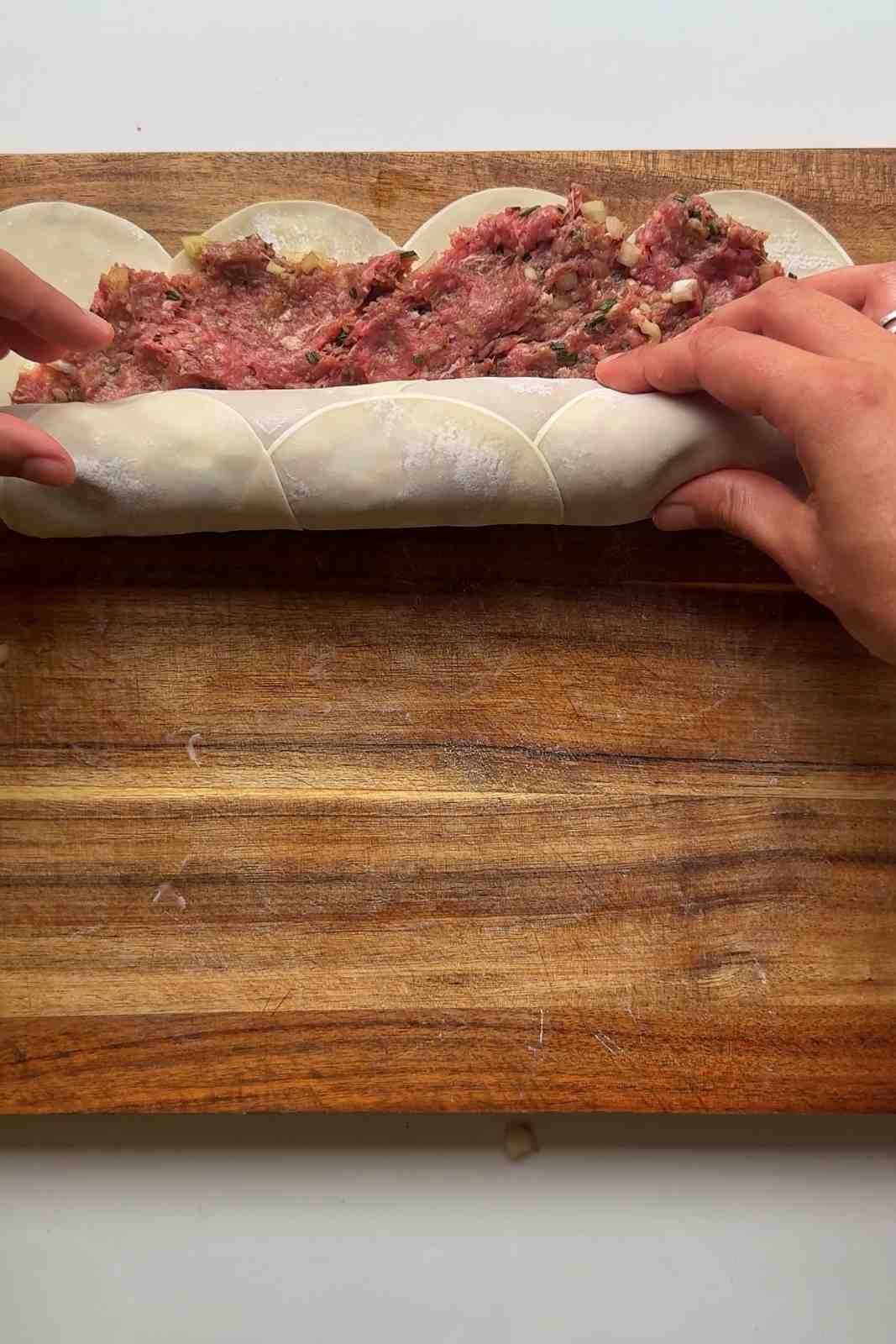 Rolling up the dumpling wheel.
