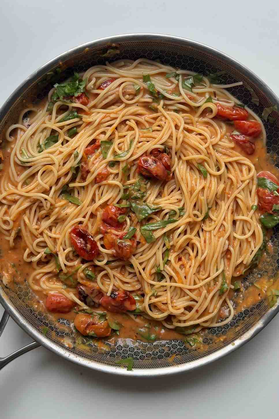 Roasted tomato pasta in a skillet.