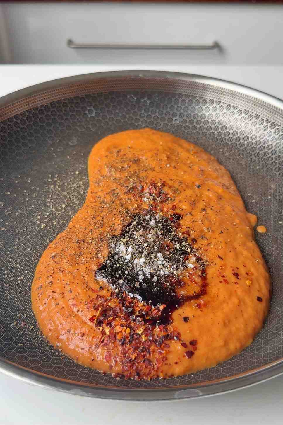 Blended roasted tomato pasta sauce in a skillet.