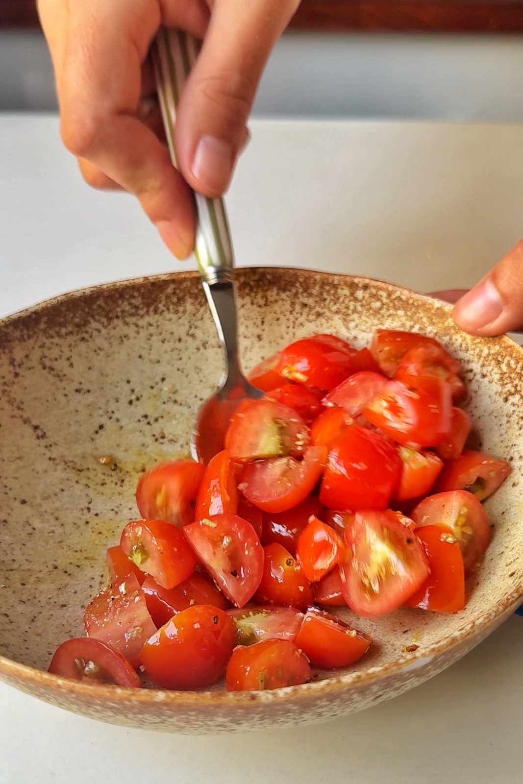 Making balsamic tomatoes.