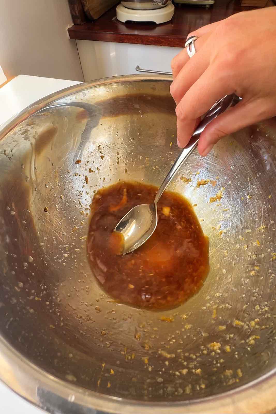 Stirring the orange tofu marinade.