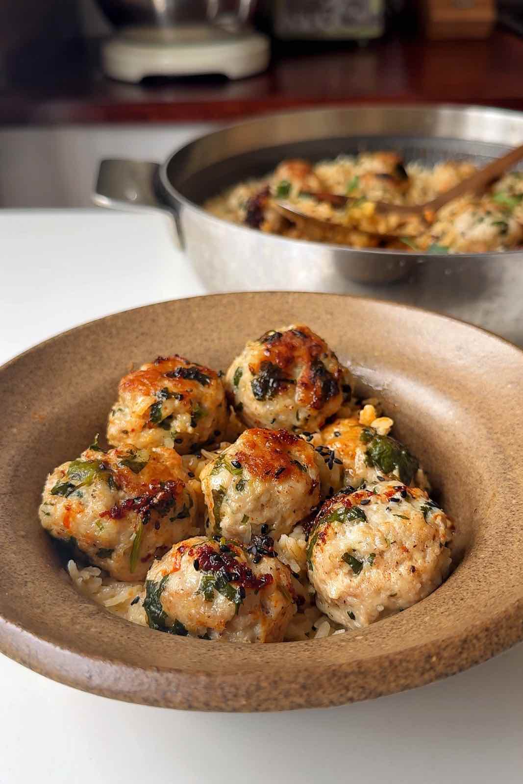 Thai chicken meatballs in a brown bowl.