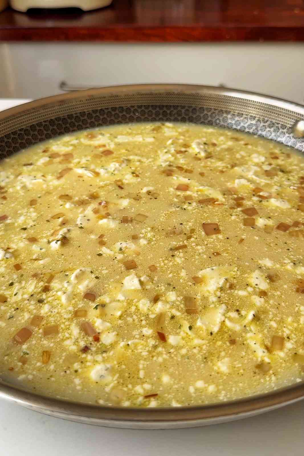 Creamy sauce in pan.