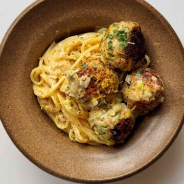 Zucchini meatballs in a brown bowl.