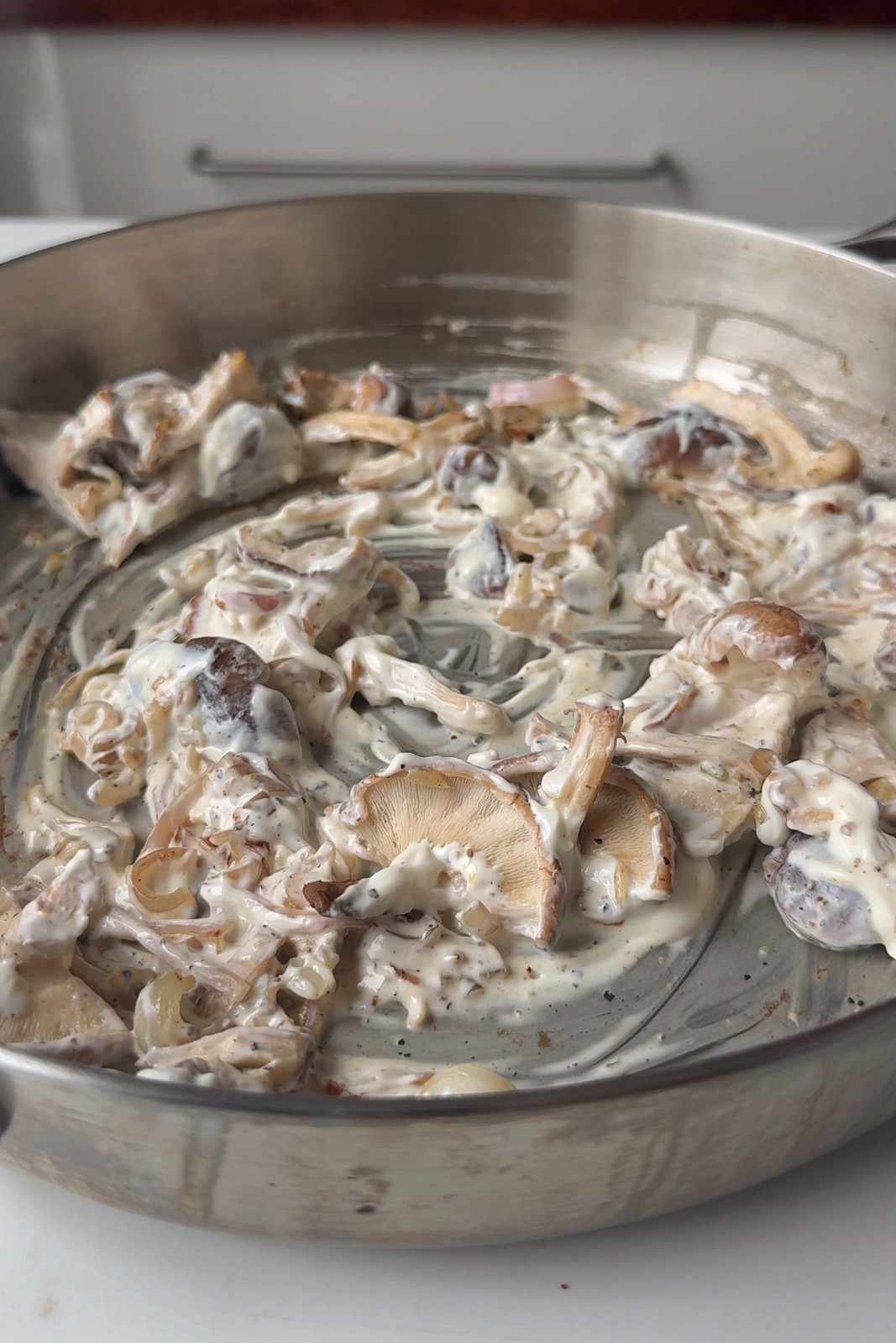 Cream cheese stirred through fried mushrooms and shallots in a skillet to make a creamy base.