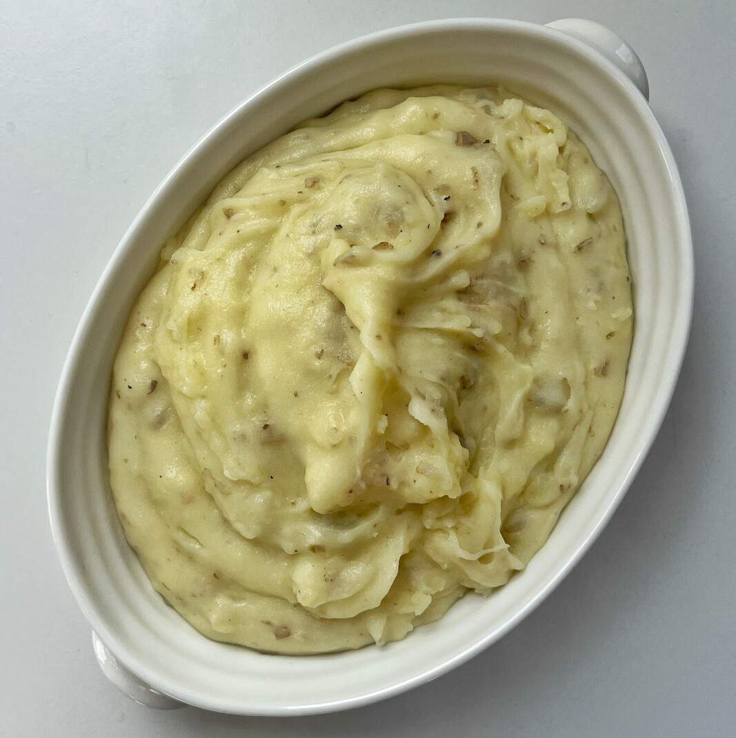 Creamy mashed potatoes in a bowl.