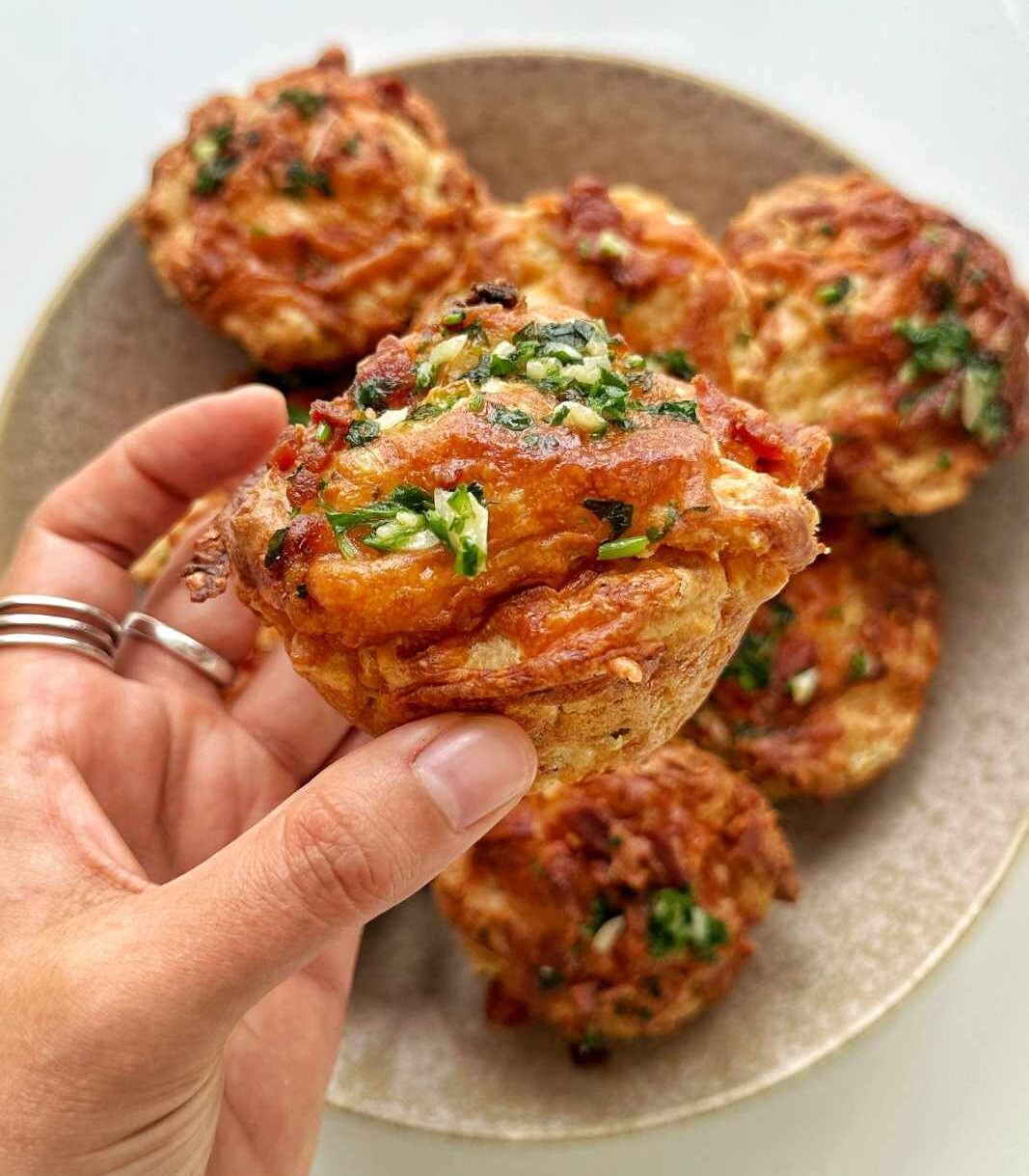 Savory cheese and bacon muffins with scallions.